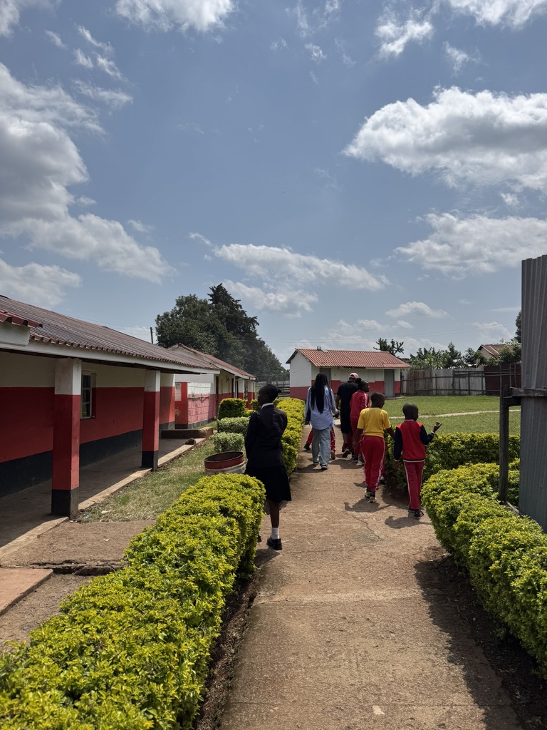 Students walking through the grounds of The Elimu Academy
